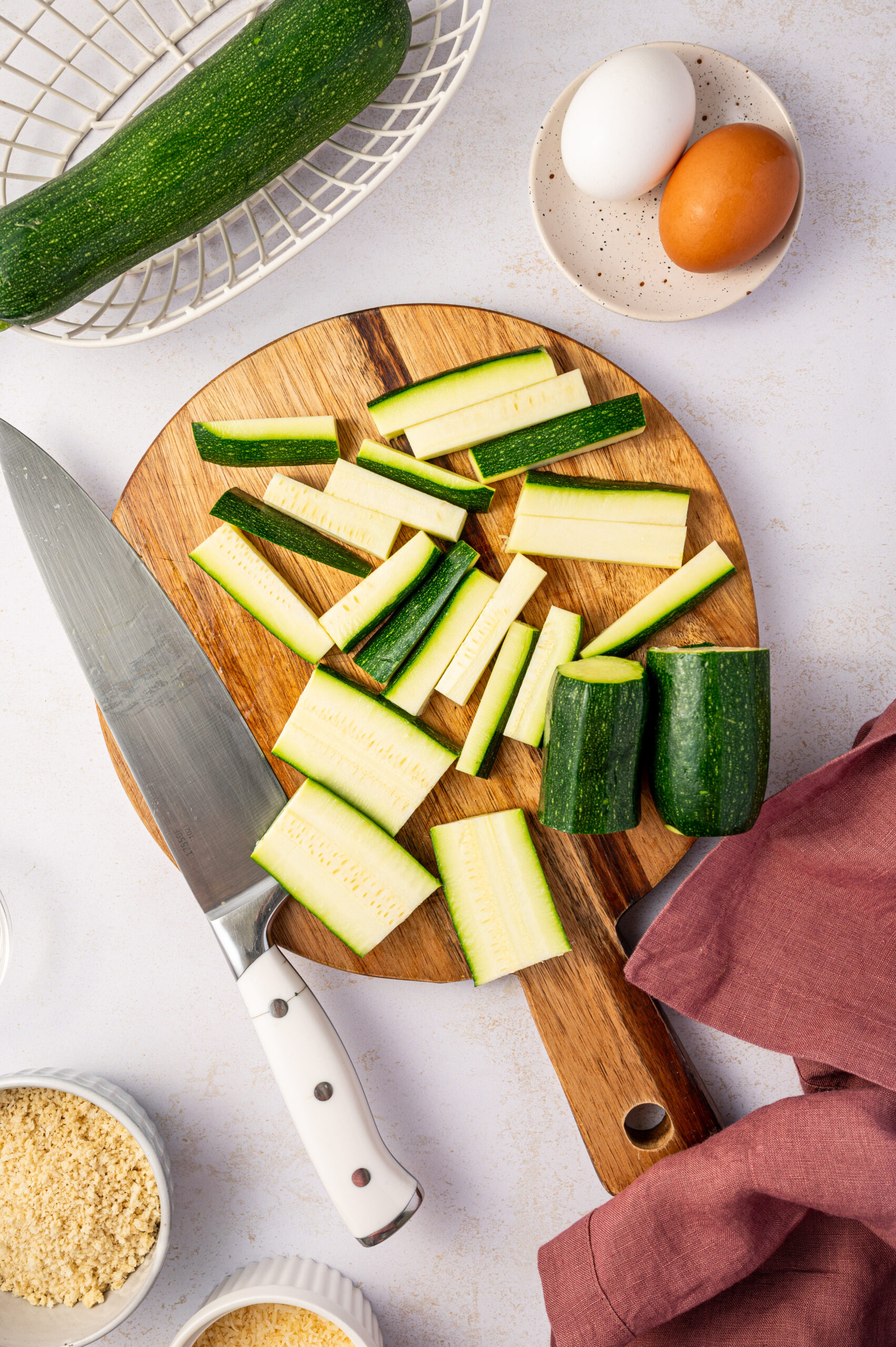 Cutting zucchini into sticks for air fryer zucchini fries.