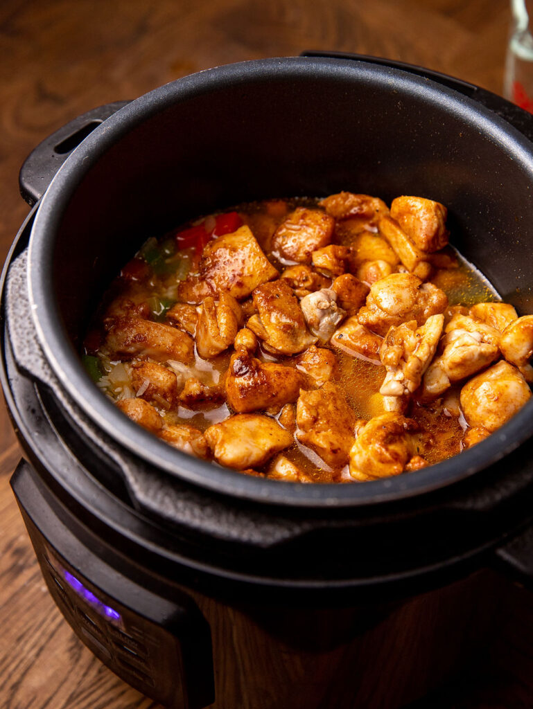 Cajun chicken and rice cooking in an Instant Pot.