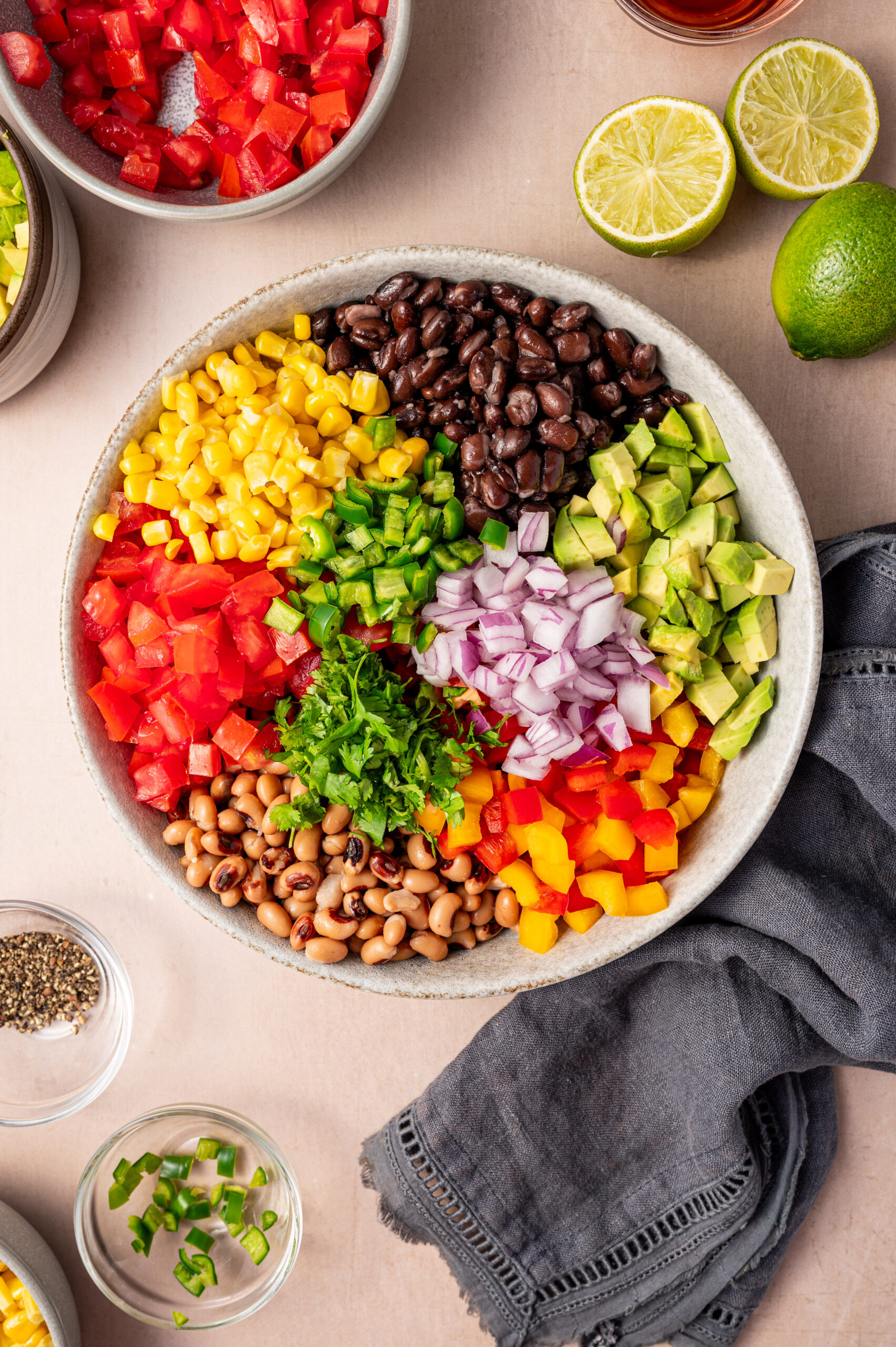 All the fresh ingredients unmixed in a large white bowl.
