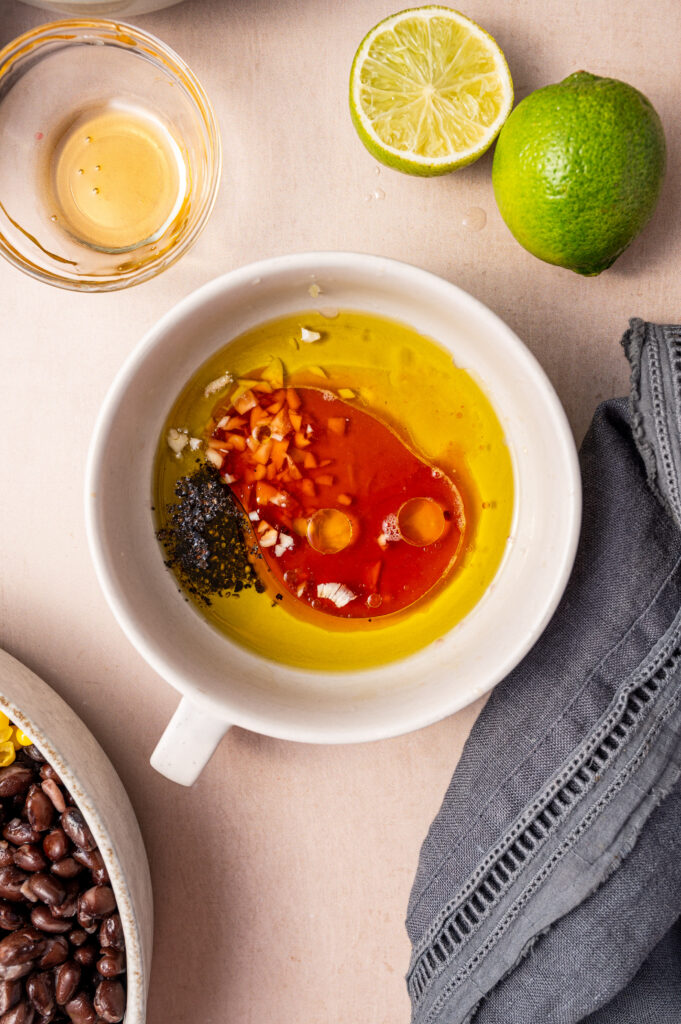 Mixing the ingredients for the cowboy caviar dressing.