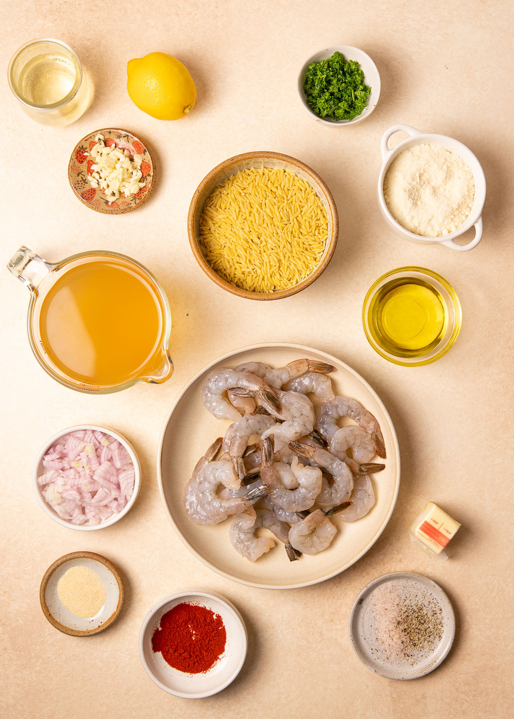 Ingredients for roasted shrimp and orzo on a counter top.