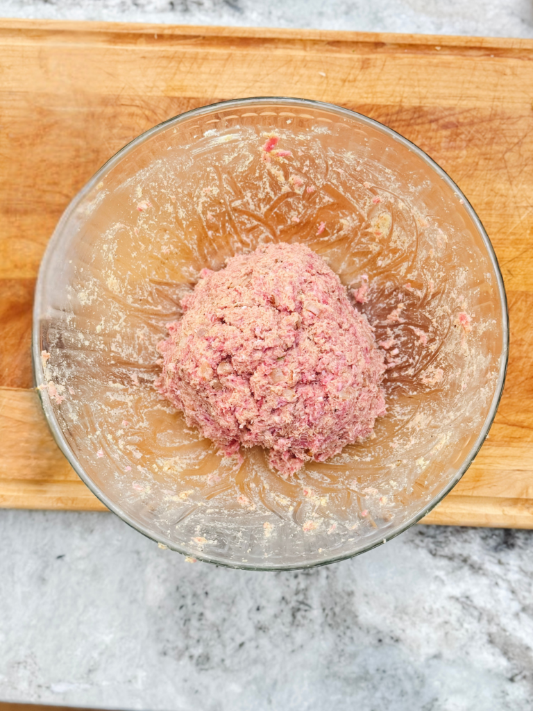 A ball of ground beef for a delicious classic meatloaf recipe.