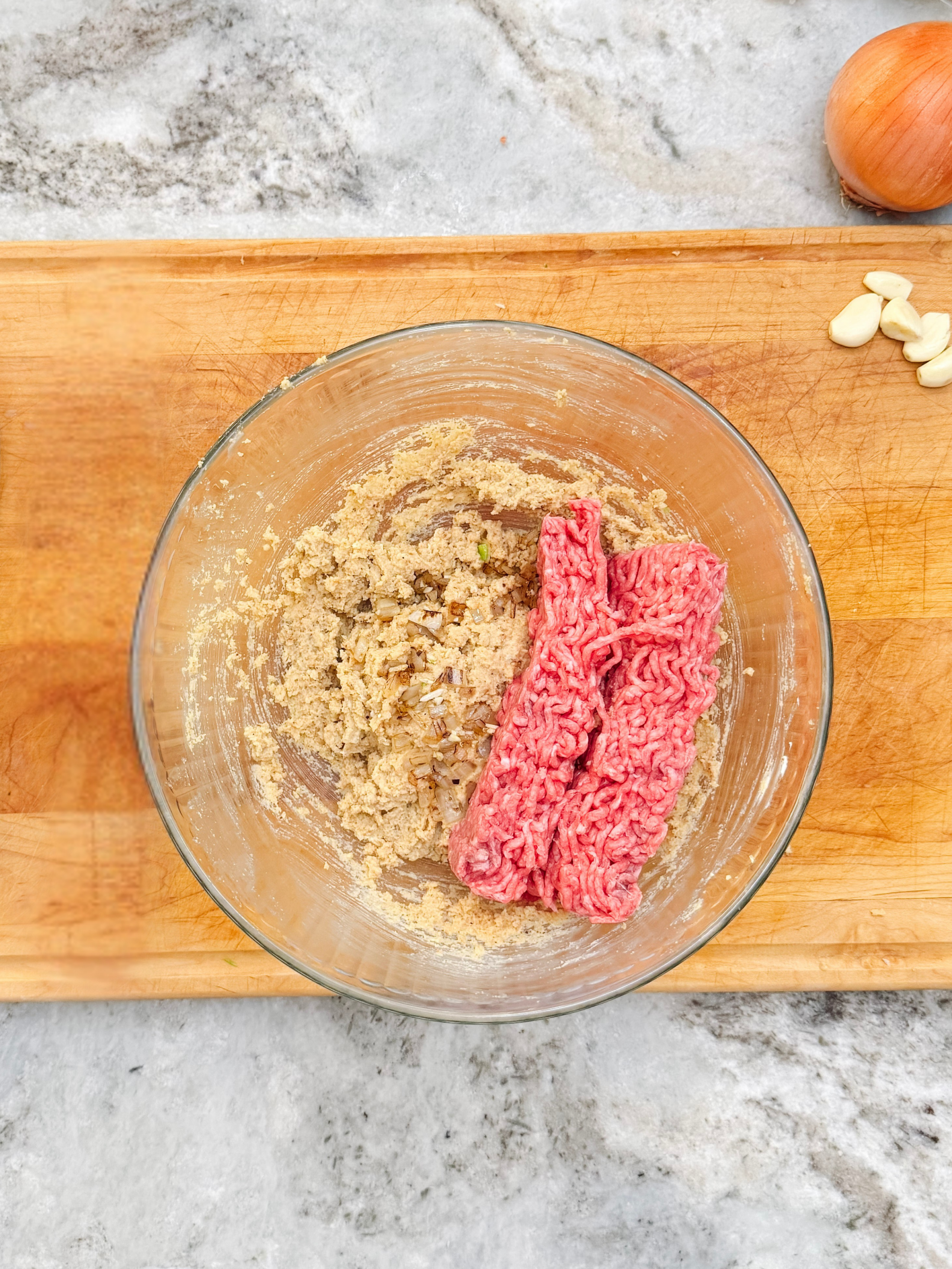 Ground beef and egg-breadcrumb mixture for our classic meatloaf recipe.