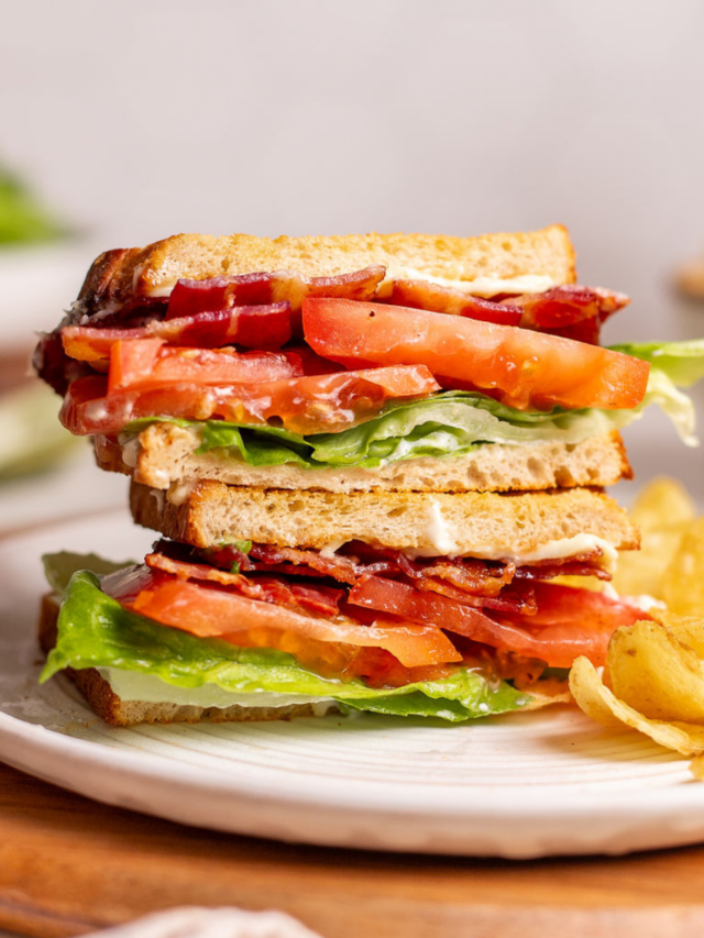 A tasty BLT sandwich on a plate with chips.
