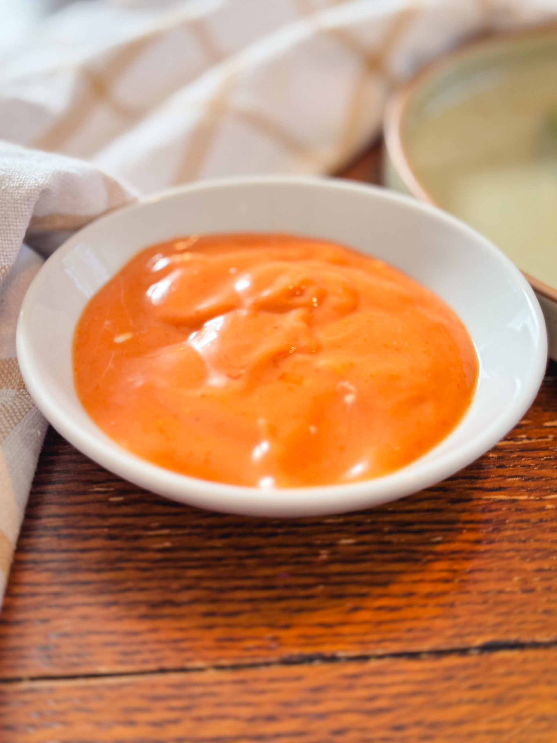 A white dish of homemade burger sauce.