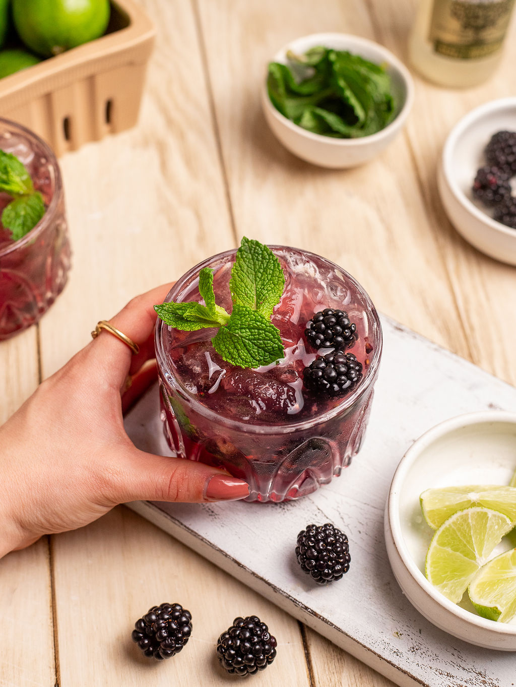 Beautiful blackberry mule mocktail garnished with mint leaves and fresh blackberries.