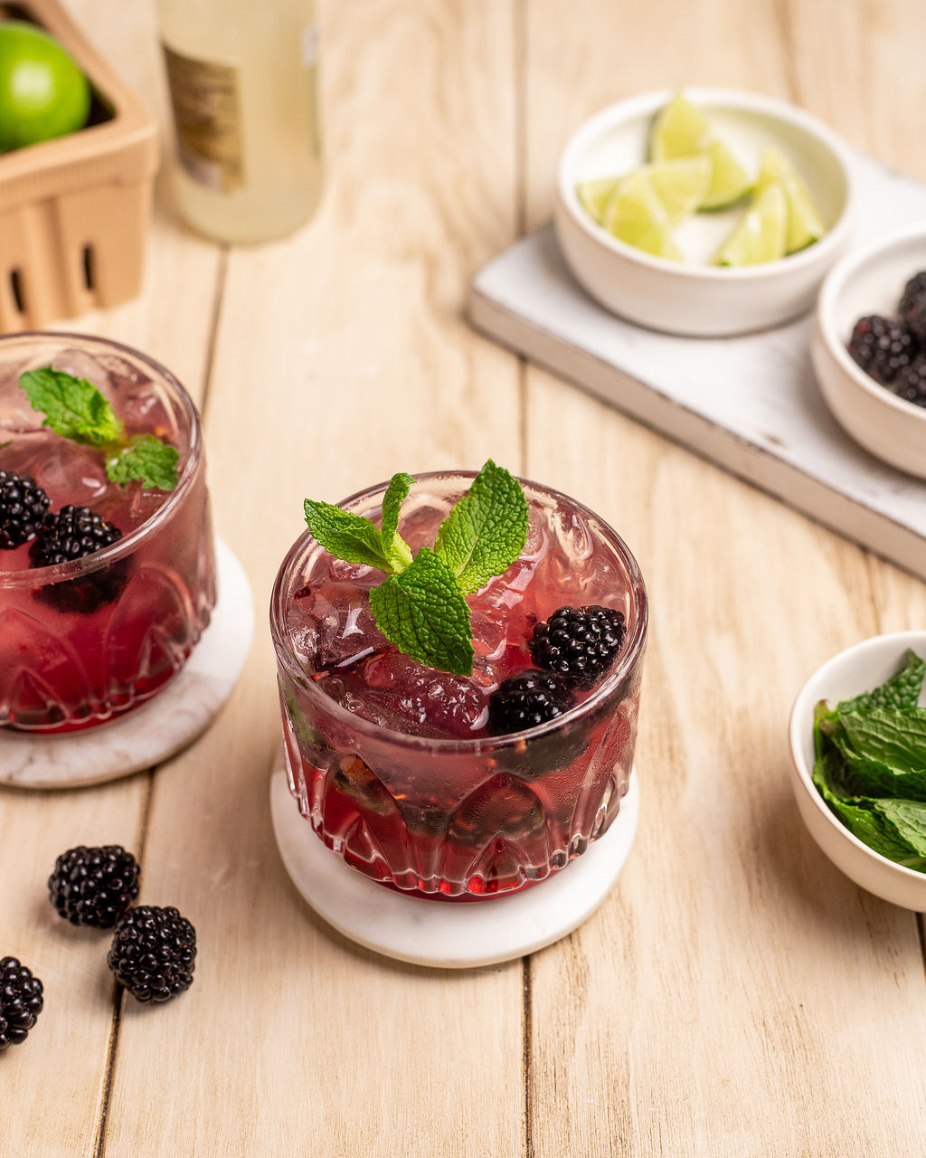 Two blackberry mules garnished with fresh blackberries and mint.