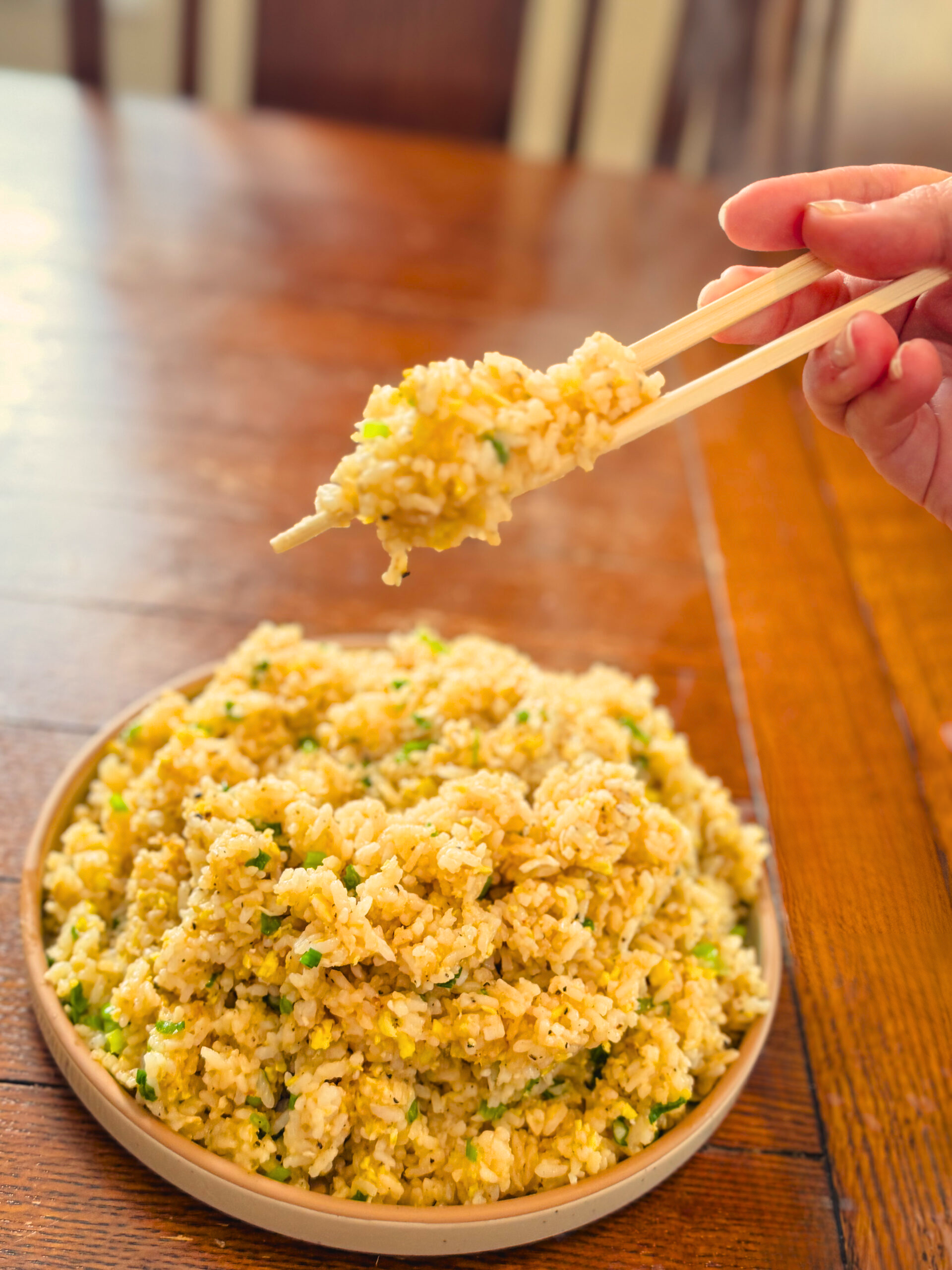 Chopsticks full of delicious fried rice.