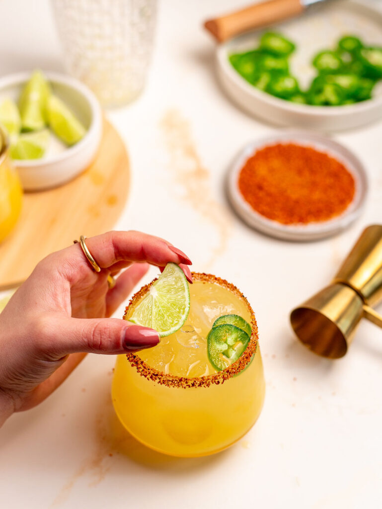 Squeezing lemon over a spicy mockarita.