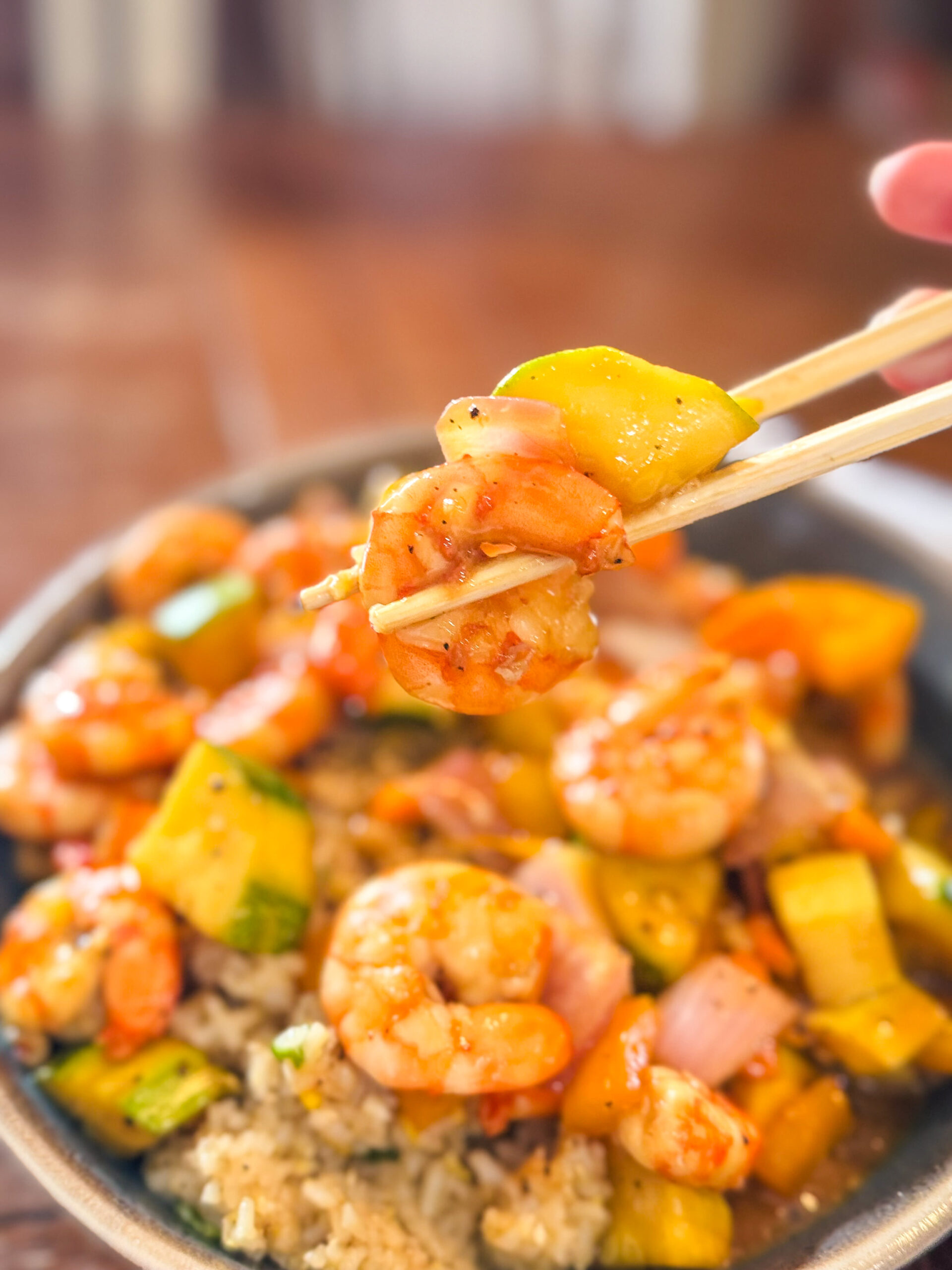 Chopsticks full of delicious sheet pan teriyaki shrimp.