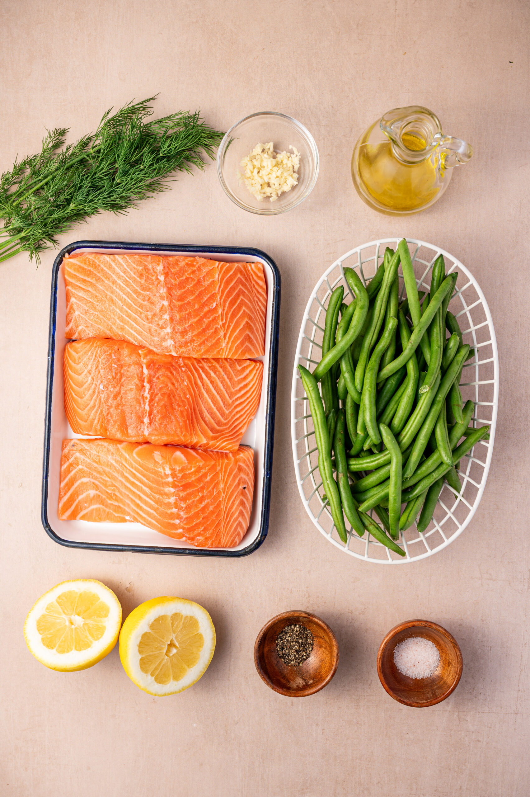 Ingredients for sheet pan lemon dill salmon with green beans.