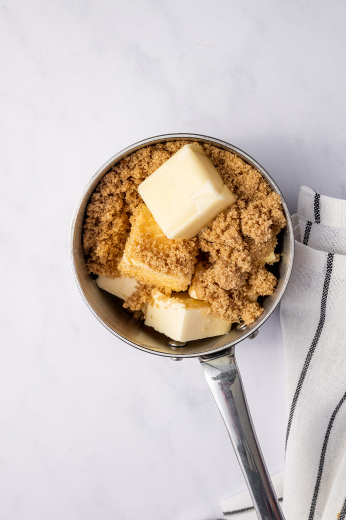Butter and brown sugar in a saucepan.