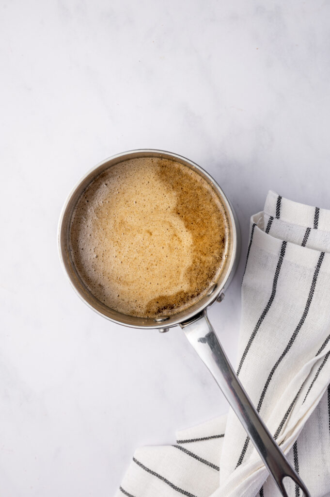 Melted butter and brown sugar in a saucepan.
