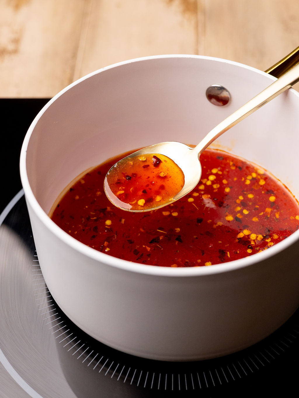 Hot honey sauce in a sauce pan.