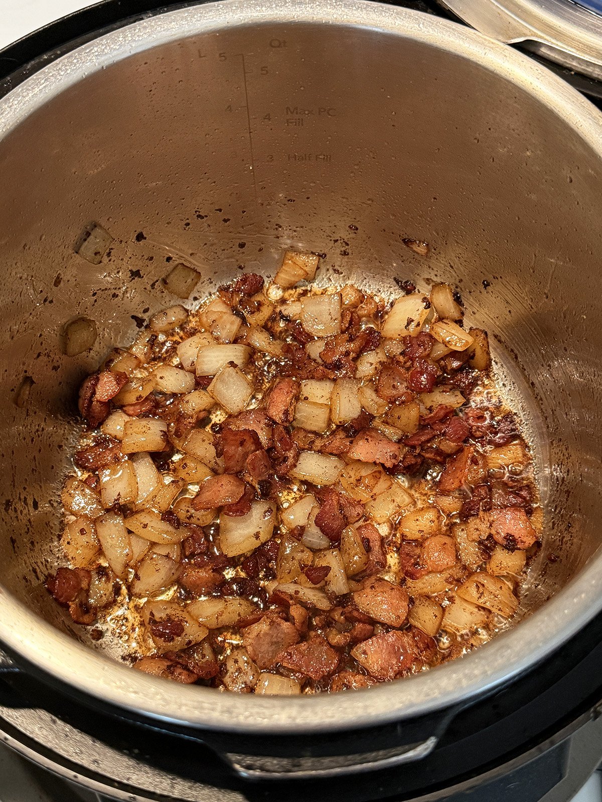Sautéing onions and bacon for Instant Pot BBQ Baked Beans.