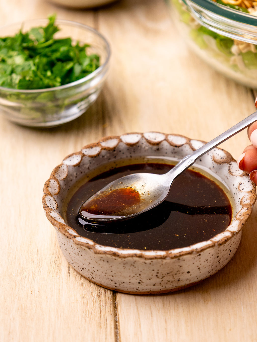 Sesame dressing in a shallow bowl.