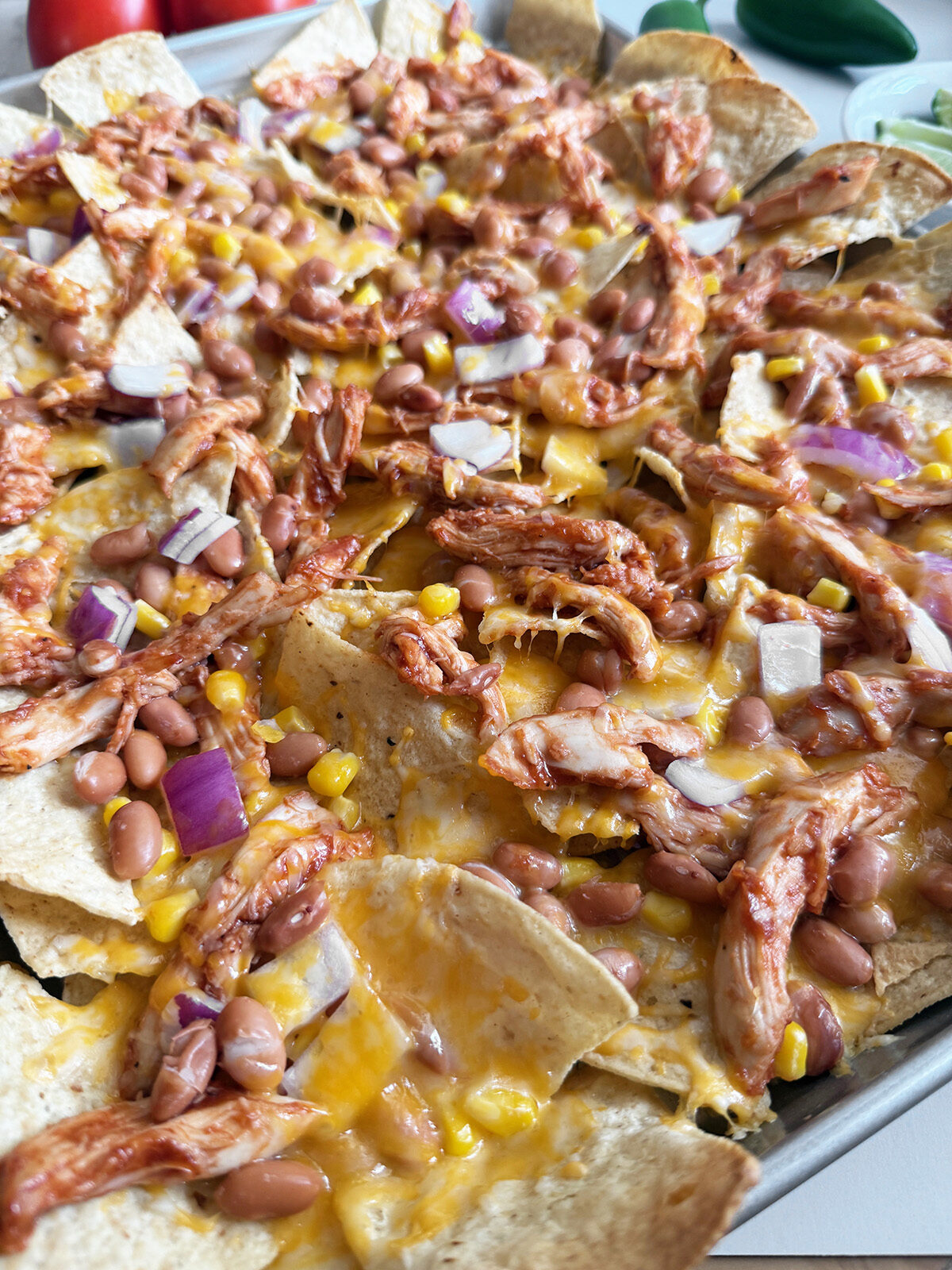 Delicious and easy sheet pan BBQ chicken nachos.