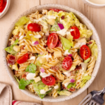 A white bowl of BLT pasta salad.
