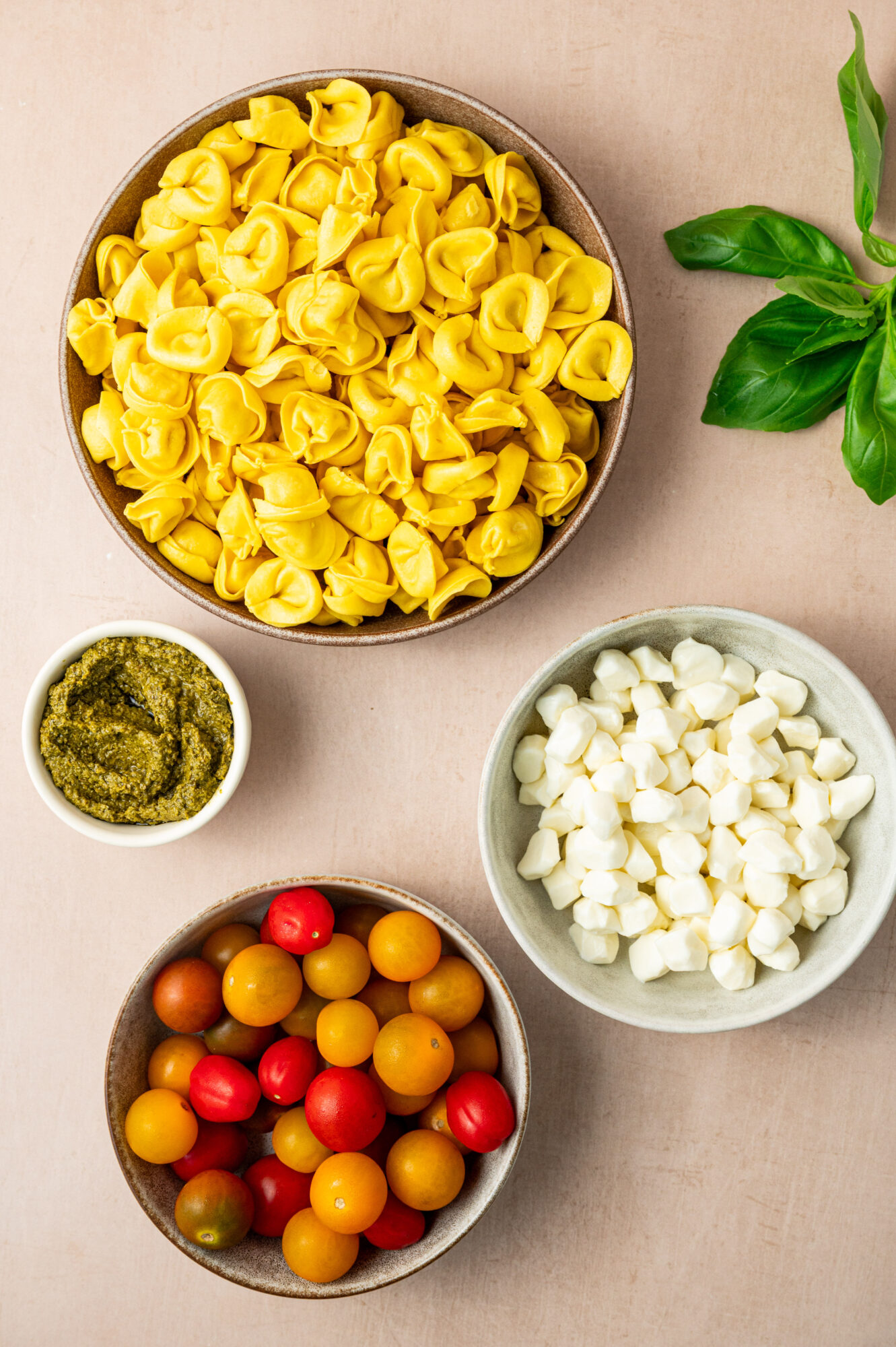 Ingredients for pesto tortellini salad.