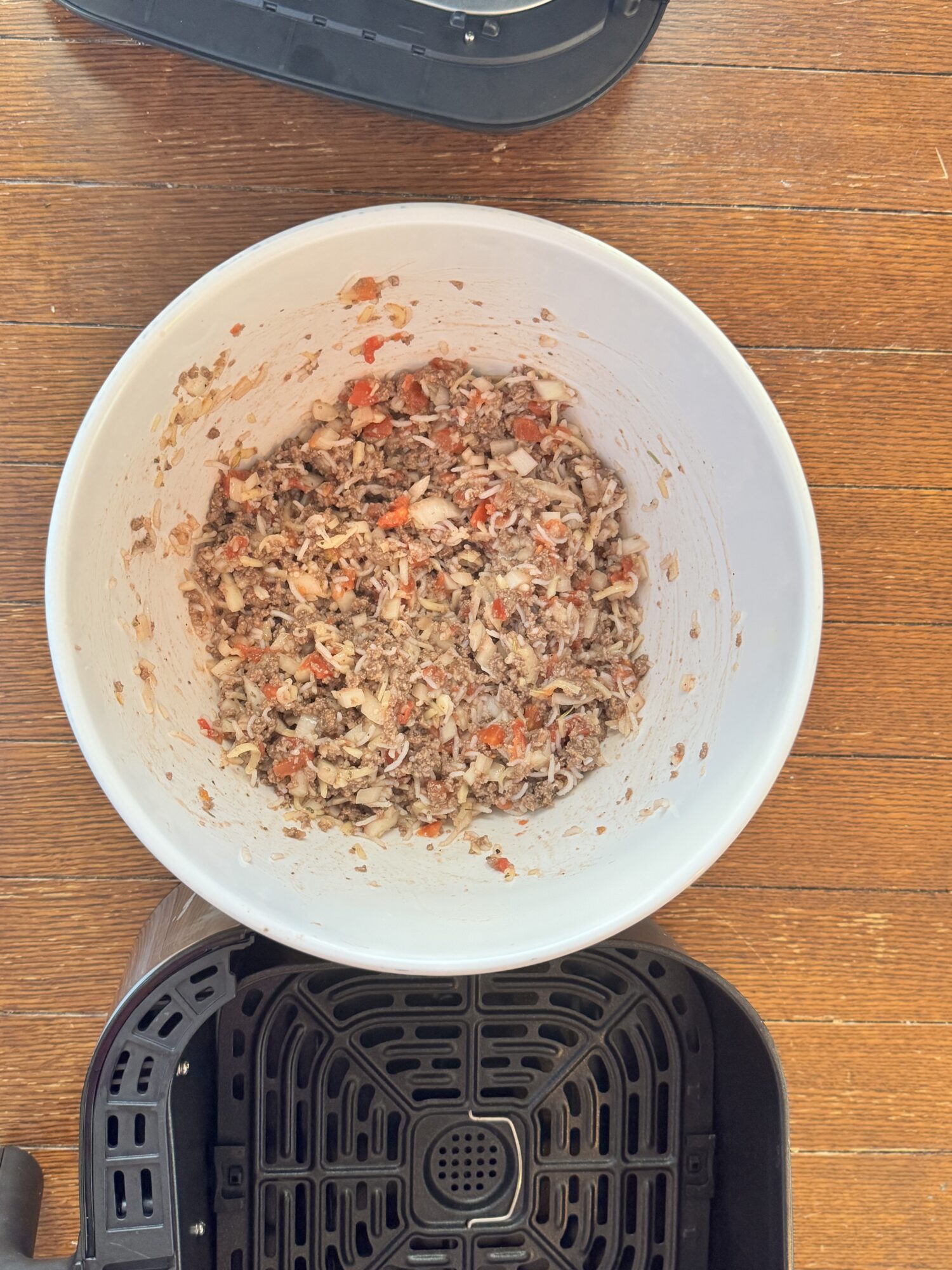 Filling for air fryer stuffed peppers in a white bowl.