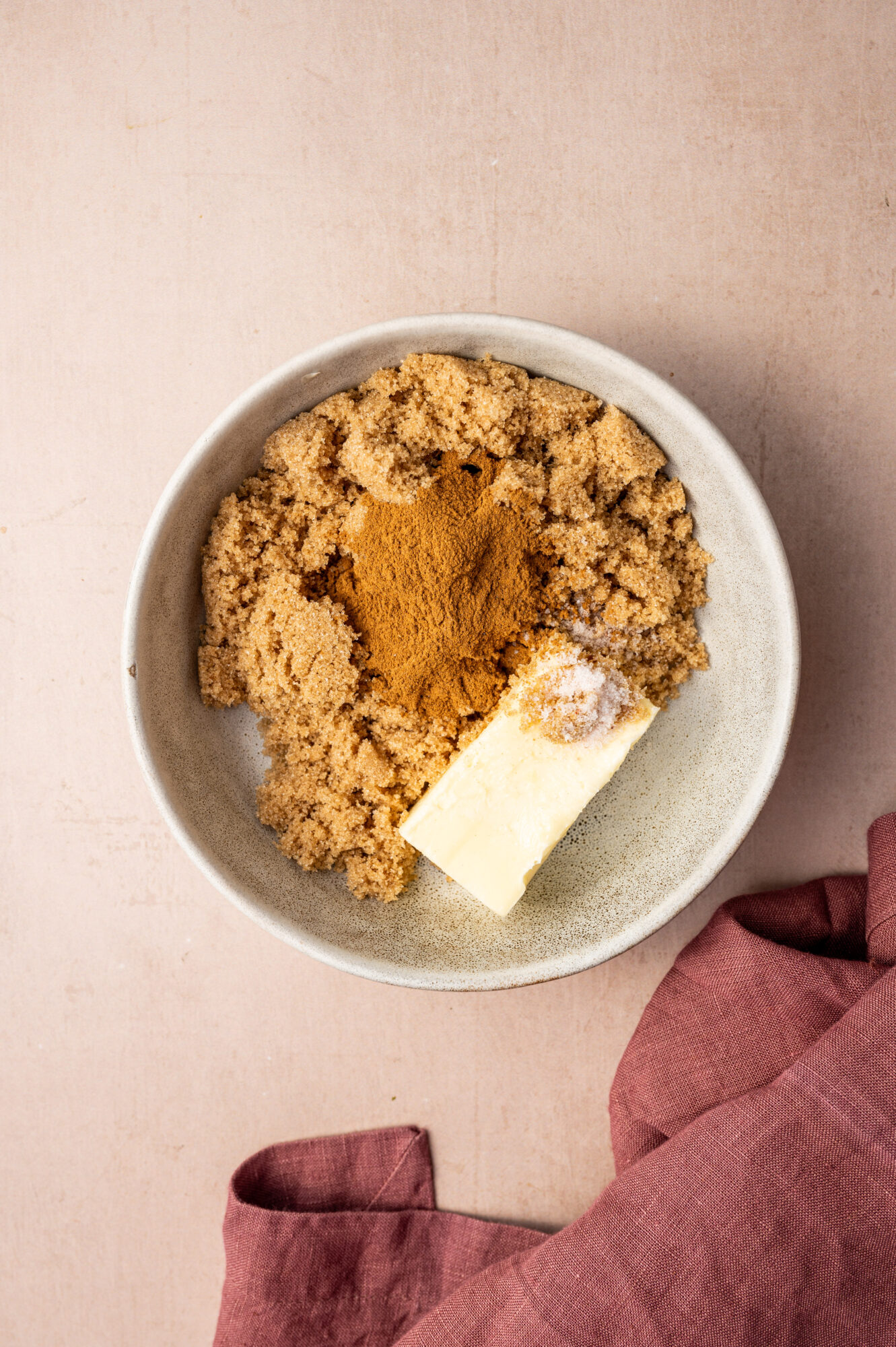 Ingredients for the cinnamon roll filling in a bowl.