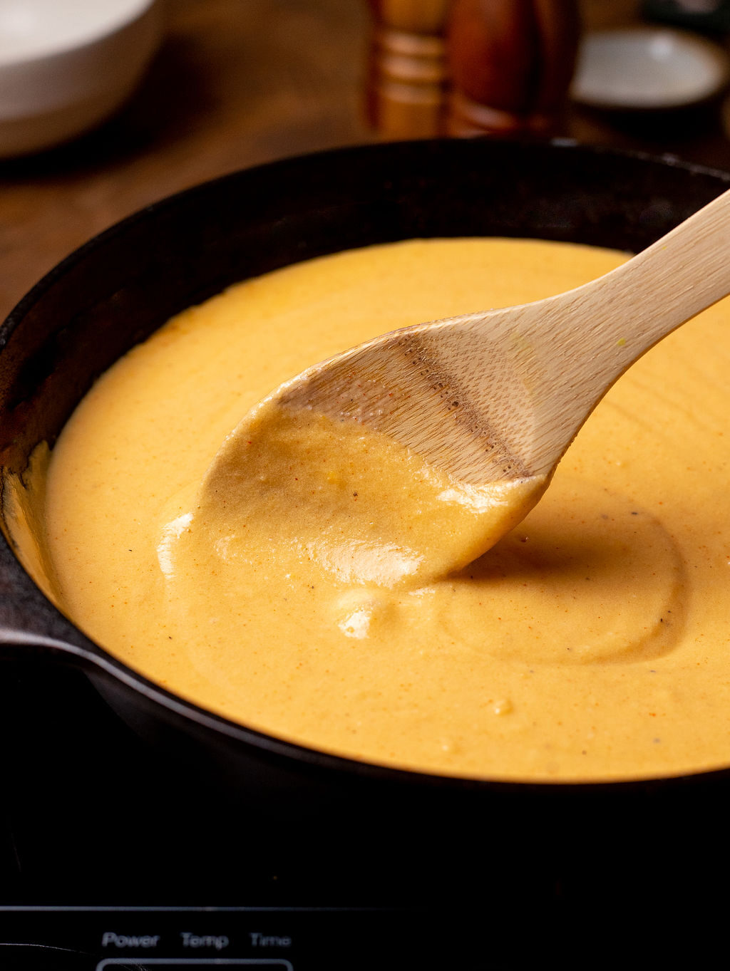 Mixing the cheese sauce for stovetop mac and cheese.
