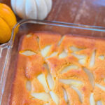 Close-up of pumpkin pear cobbler in a baking dish.