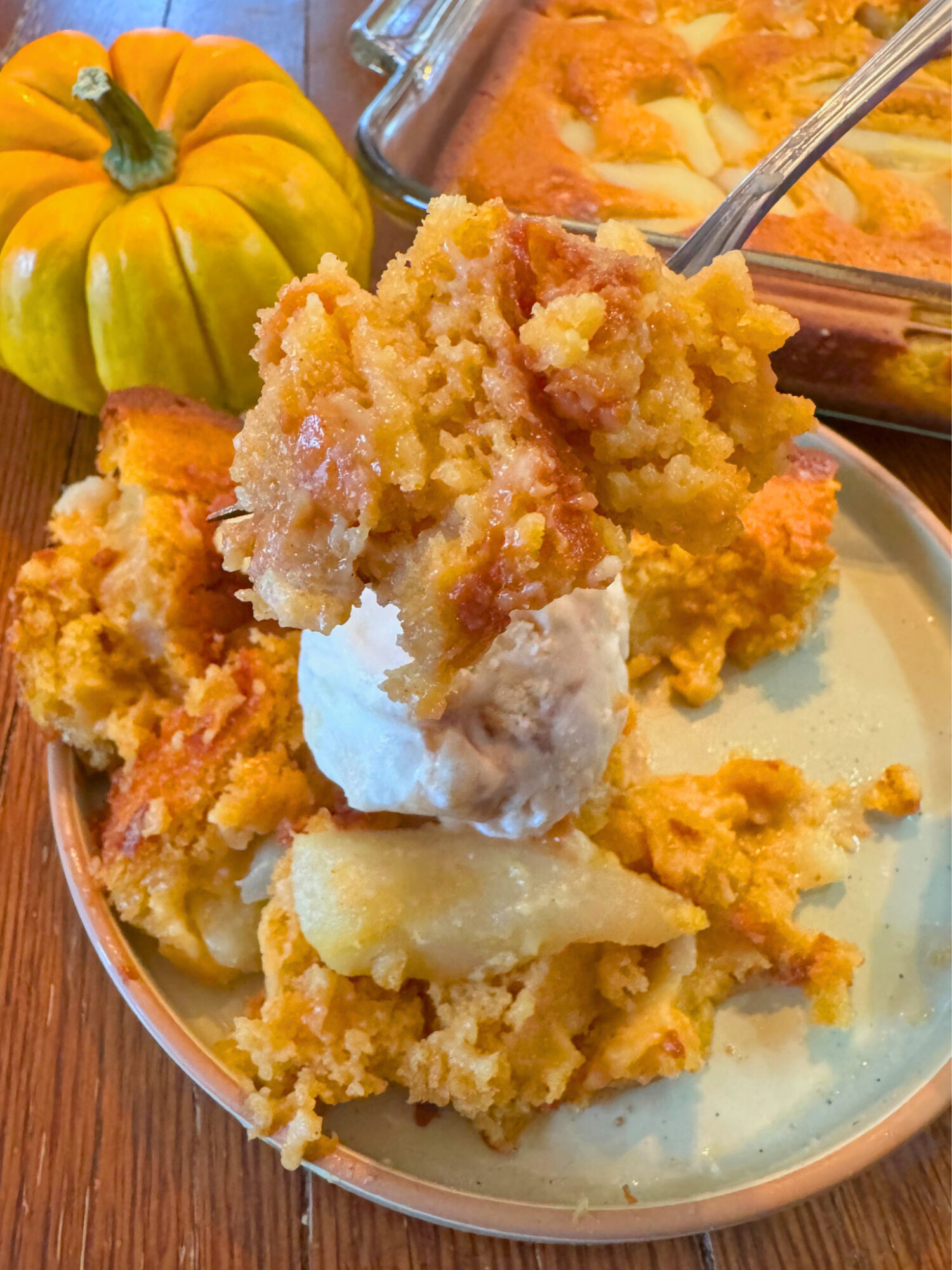 A forkful of pumpkin pear cobbler.