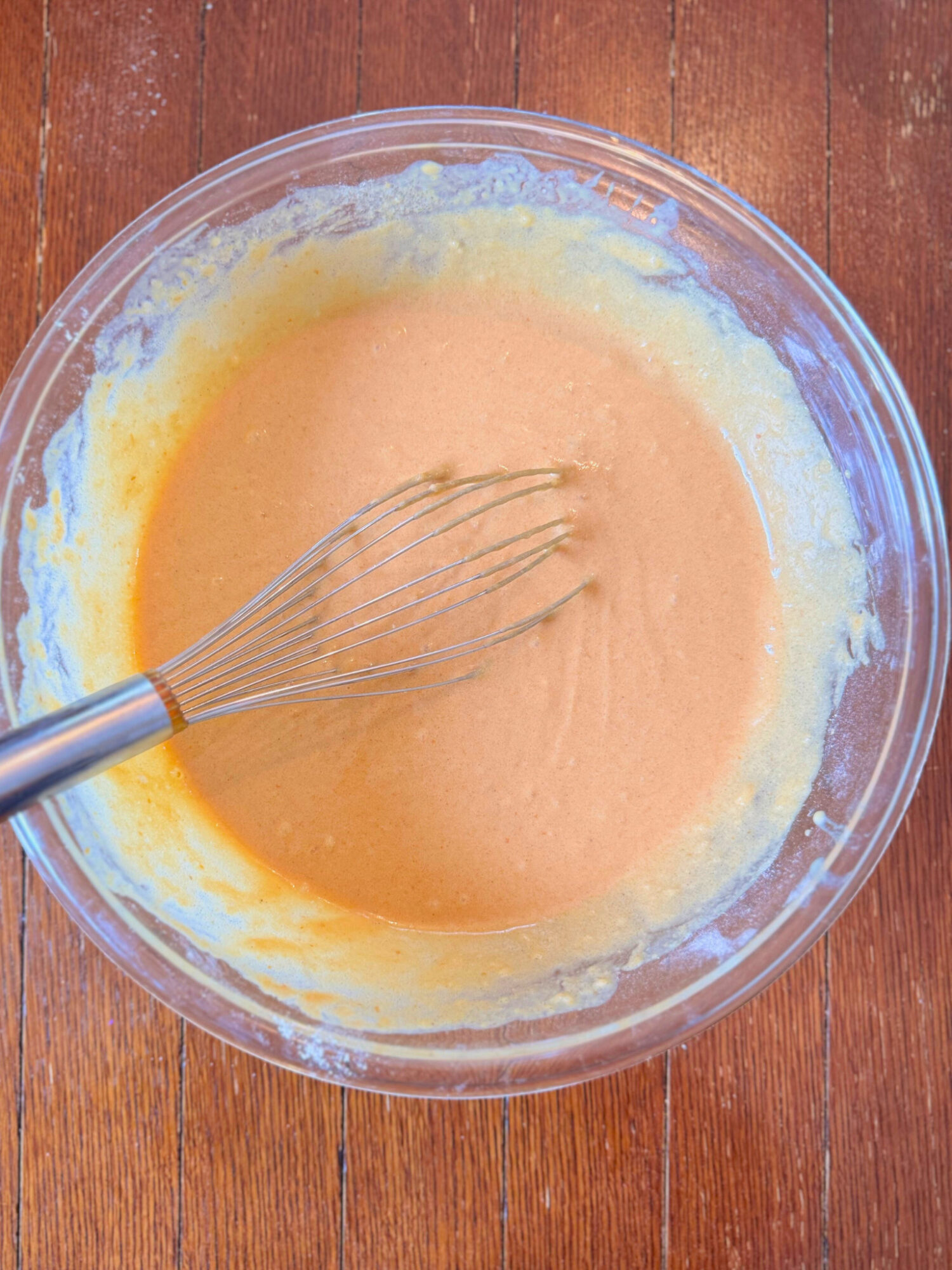 Whisking the batter for pumpkin pear cobbler.