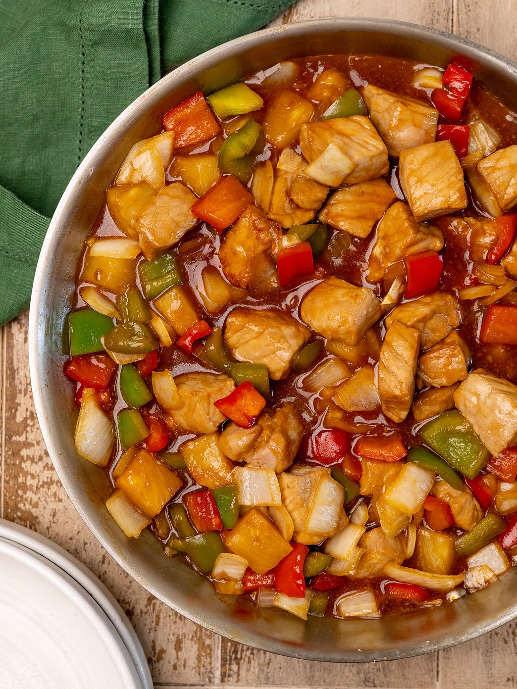 Sweet and sour pork in a skillet.