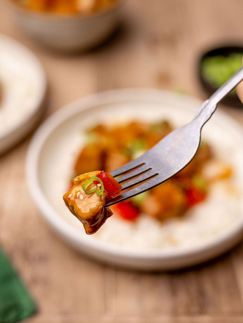 A forkful of sweet and sour pork.