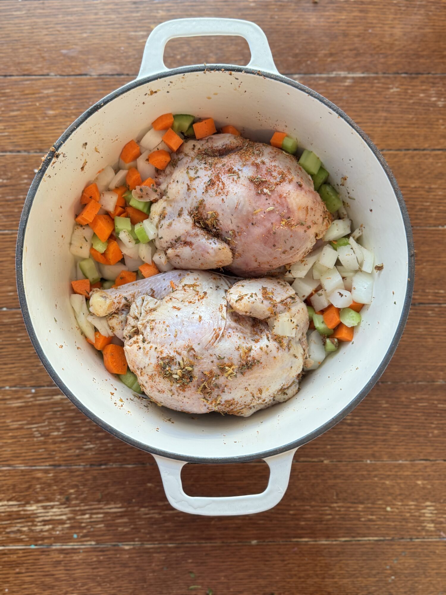 Cornish hens in a Dutch oven with veggies.