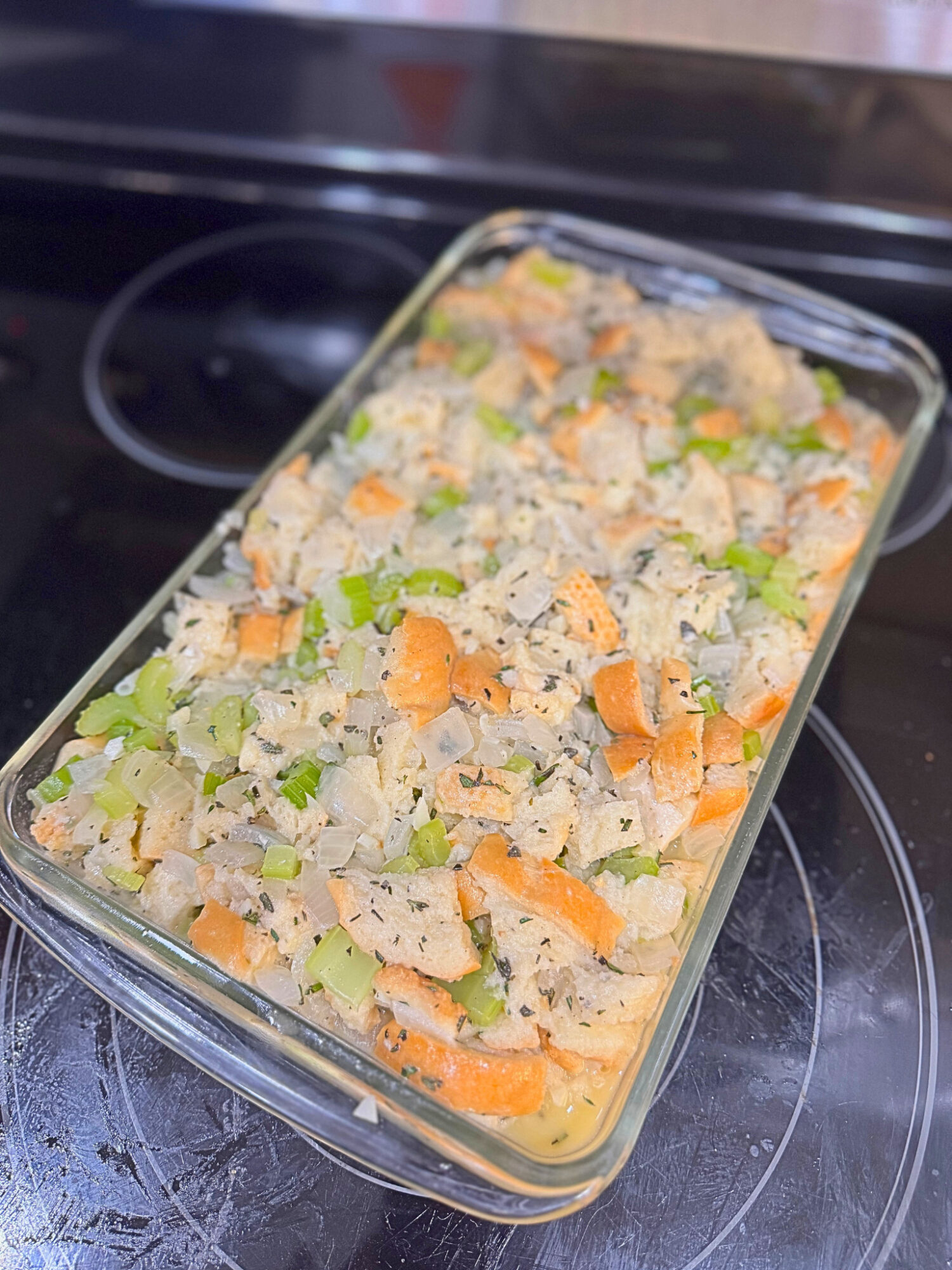 Stuffing in a casserole dish before going in the oven.