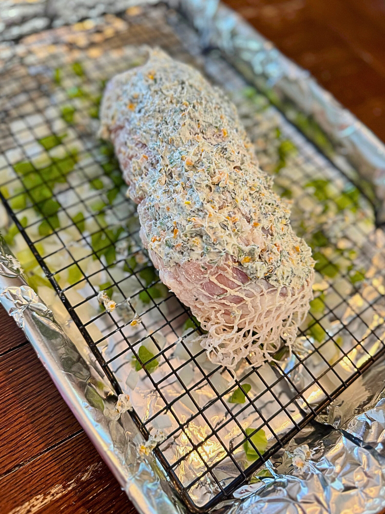 Oven-roasted turkey breast slathered in compound butter ready to bake.