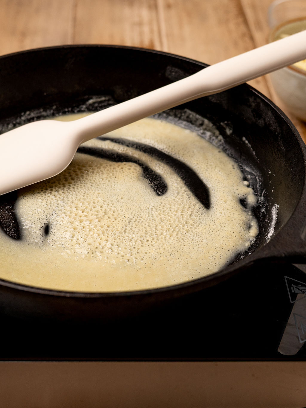 Stirring a roux for pumpkin mac and cheese.