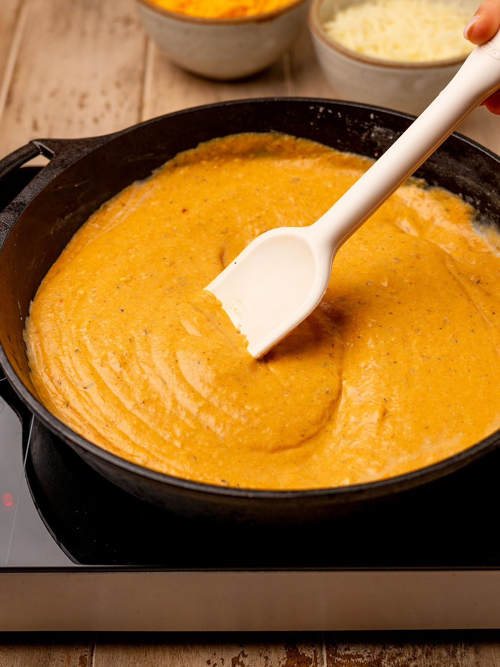 Cheese sauce in a cast iron pan.