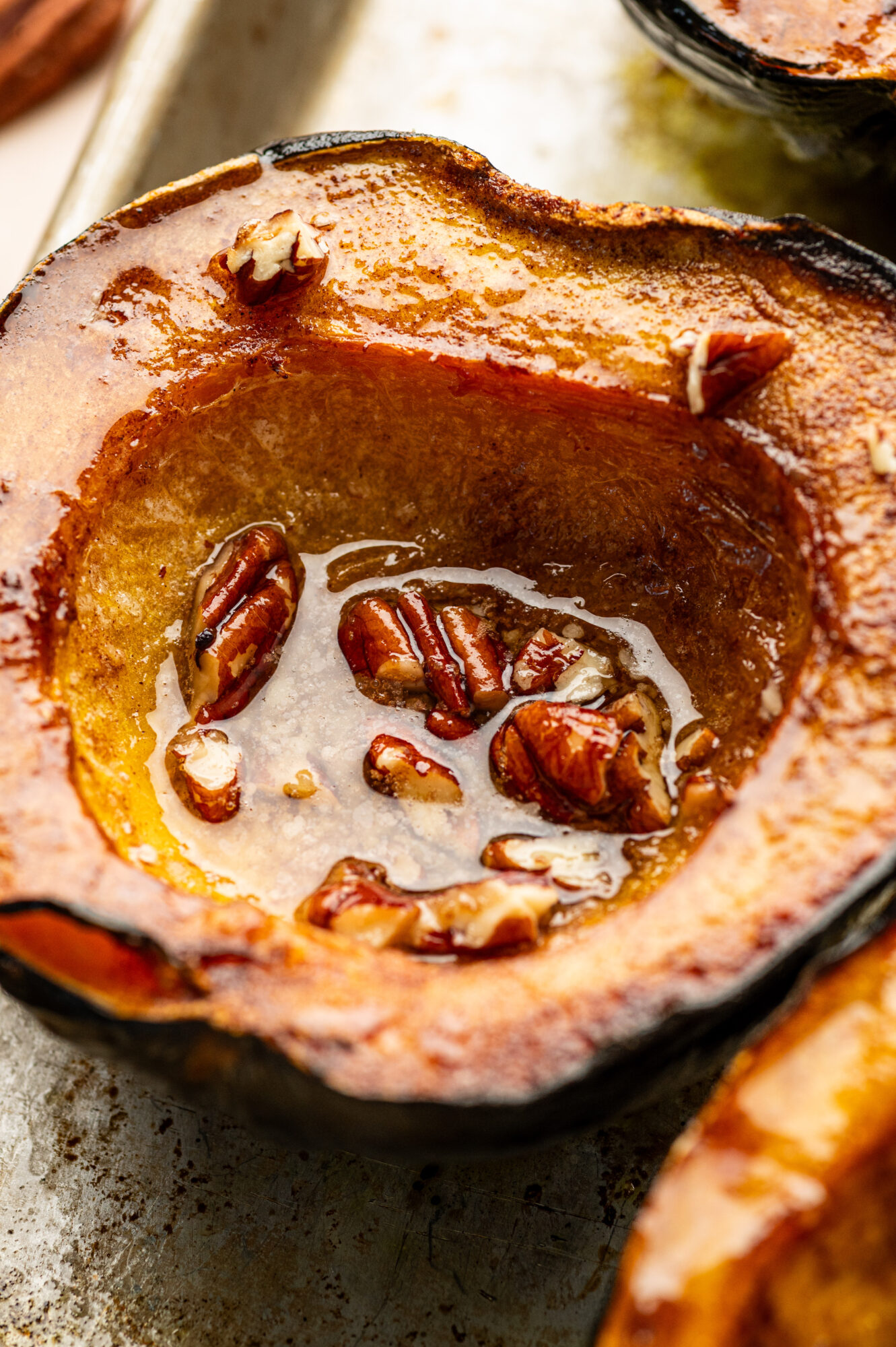Close-up of roasted acorn squash with pecans.