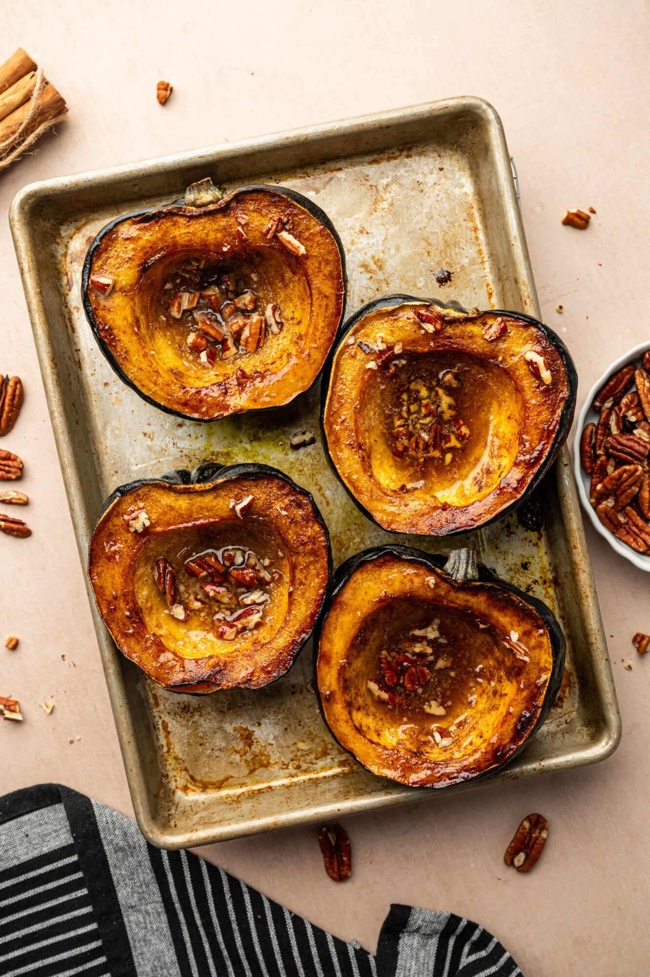 Roasted acorn squash on a pan right out of the oven.