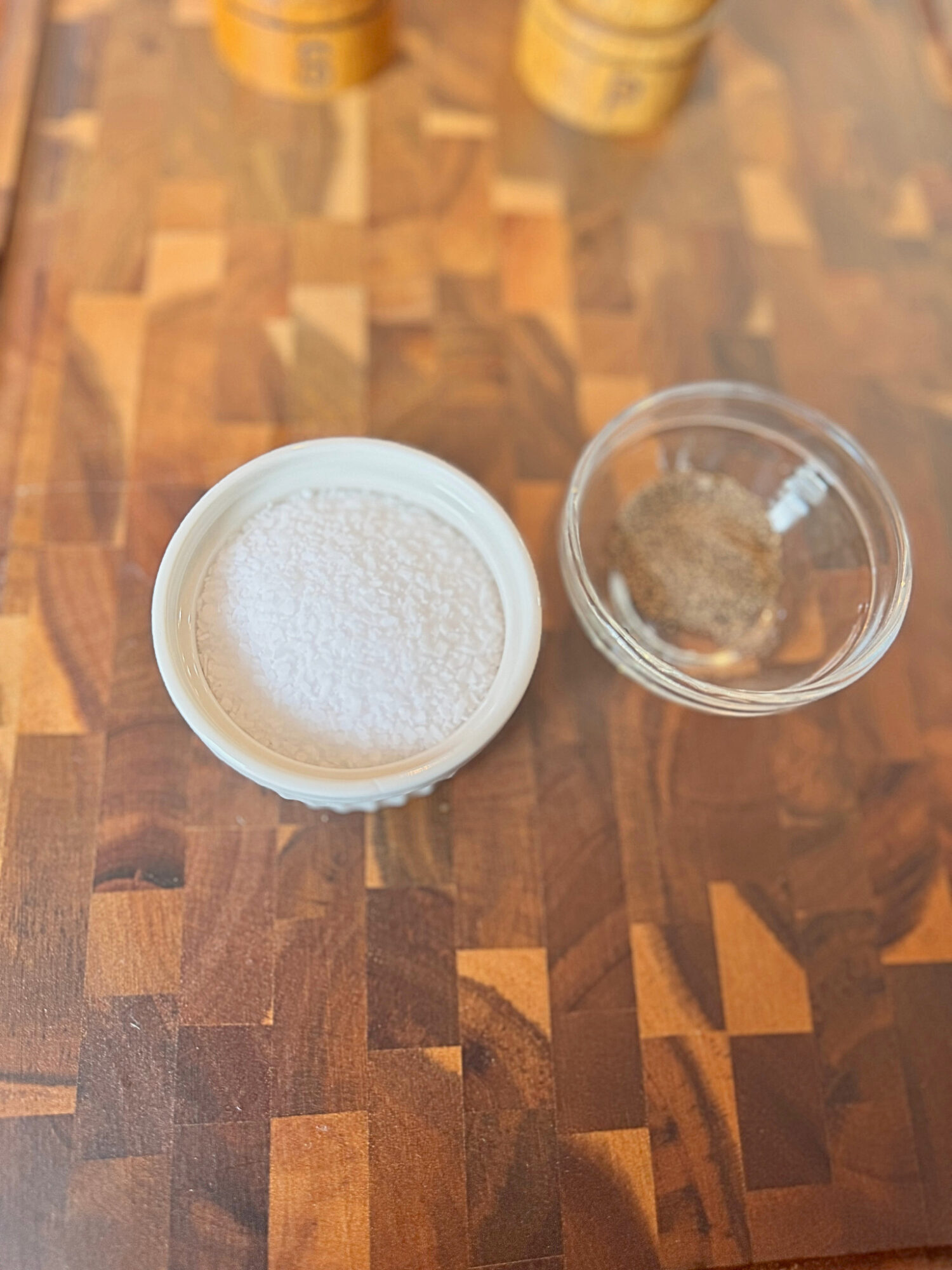 10 parts salt and 1 part pepper over a wooden surface.