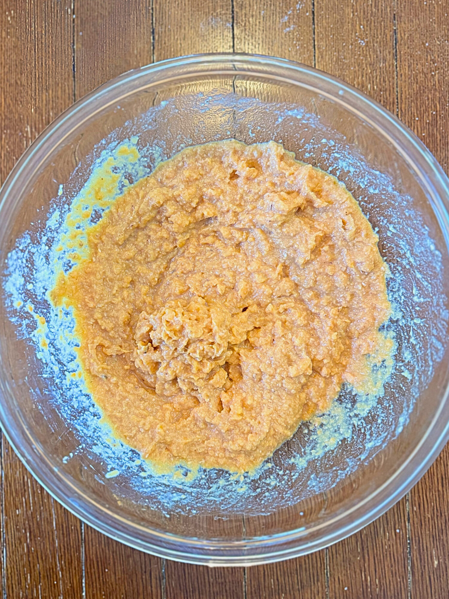 Sweet potato filling in a glass mixing bowl.