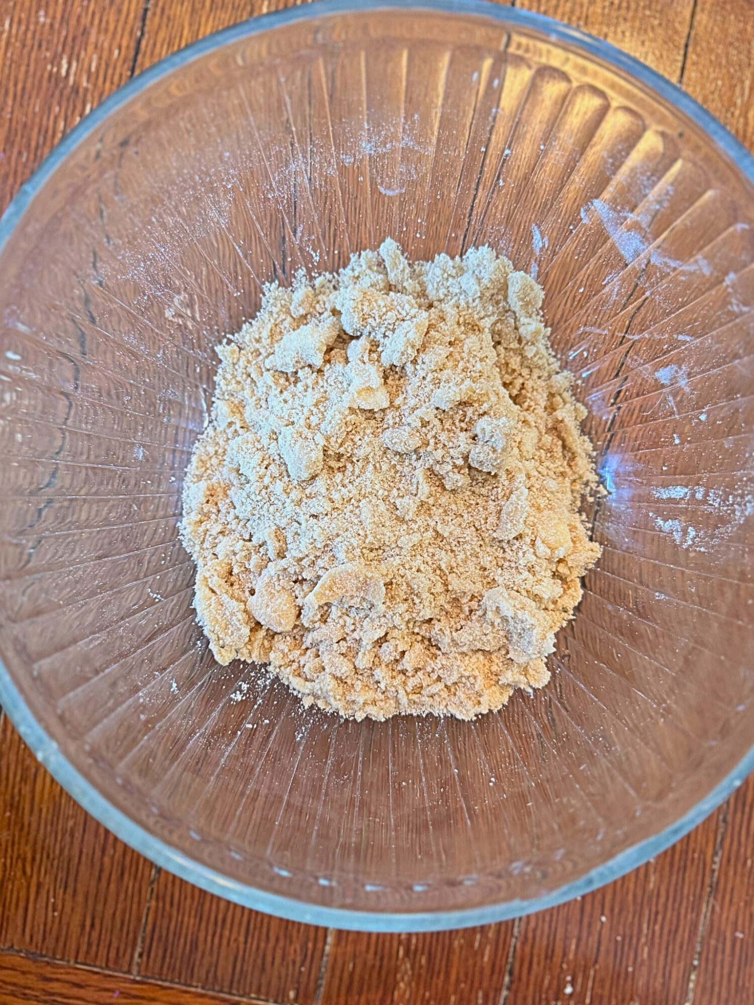 Mixed streusel topping in a glass mixing bowl.