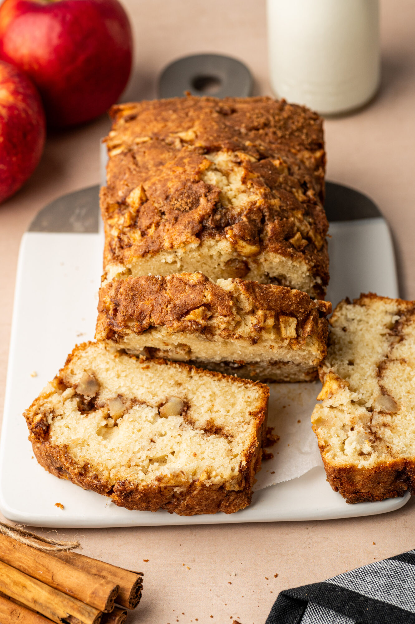 Sliced apple cinnamon bread on a white plate.