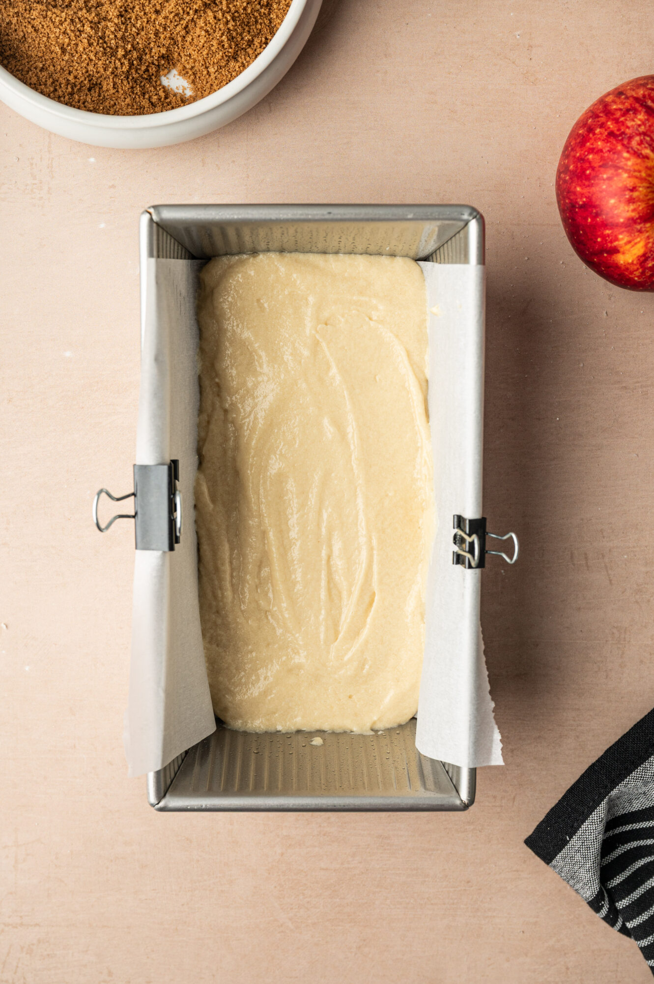 Adding batter to a loaf pan.