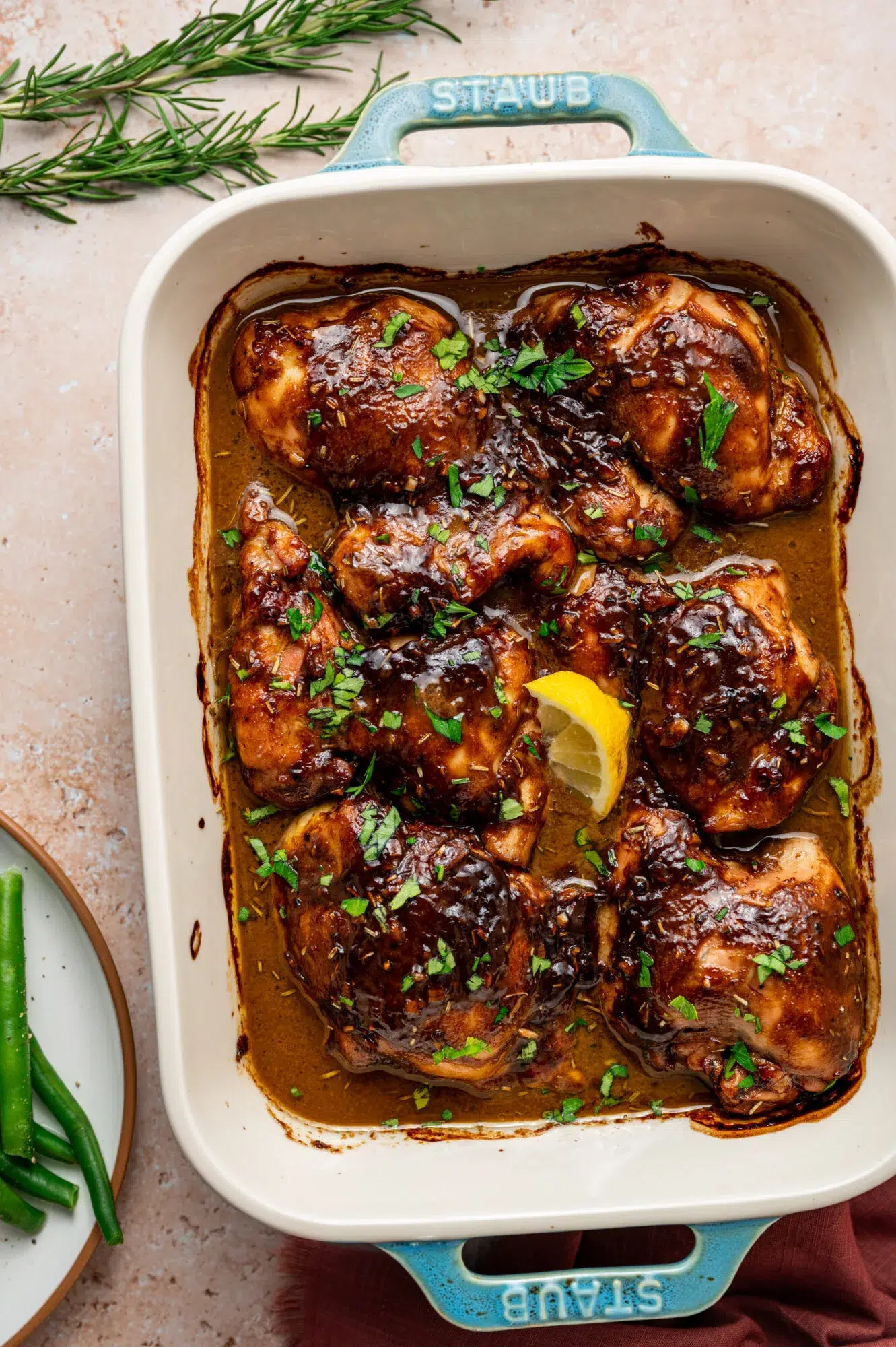 Balsamic Dijon mustard chicken thighs in a baking dish.