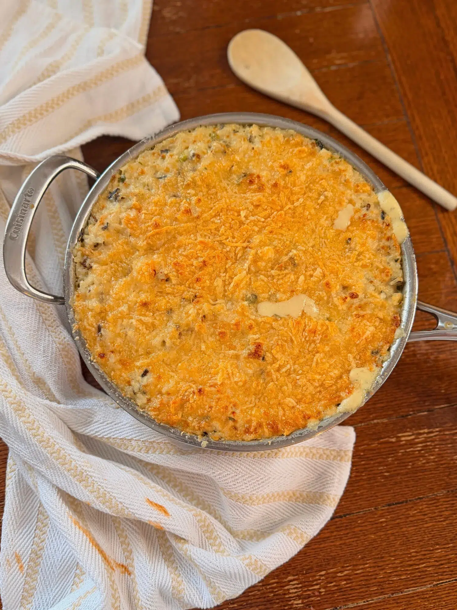 Chicken wild rice bake with a golden parmesan crust ready to serve.