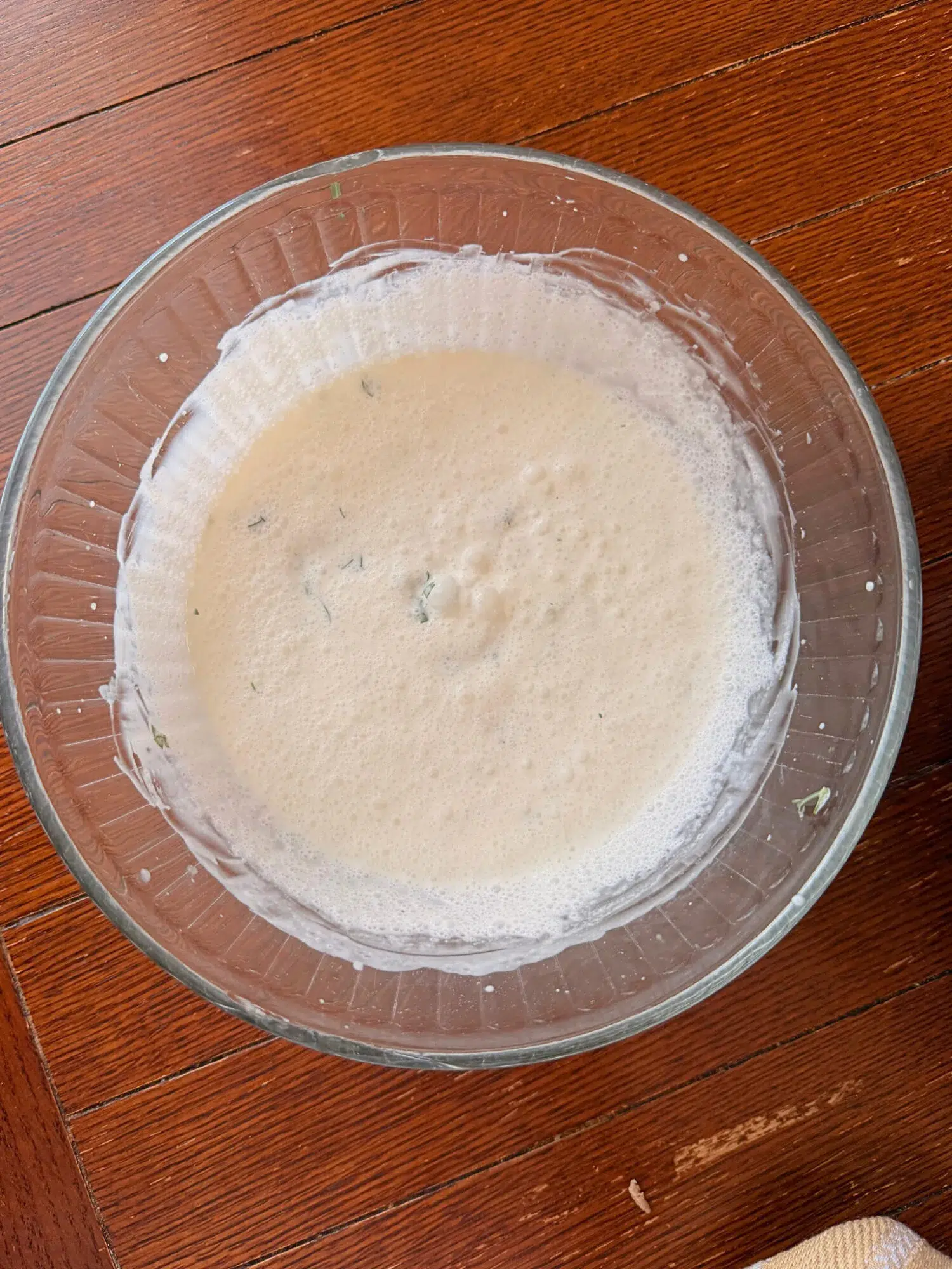 Creamy garlic sauce in a glass bowl.