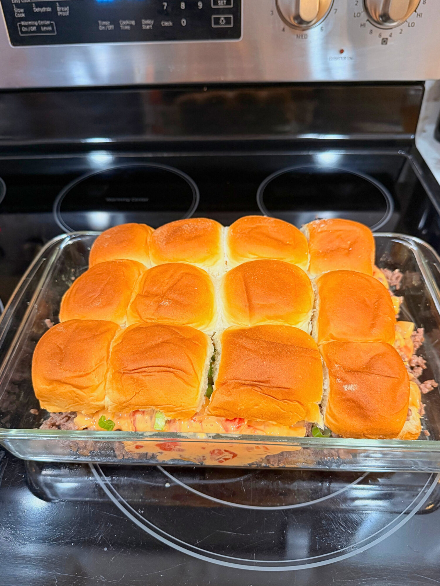 Ground beef queso sliders ready to go in the oven.