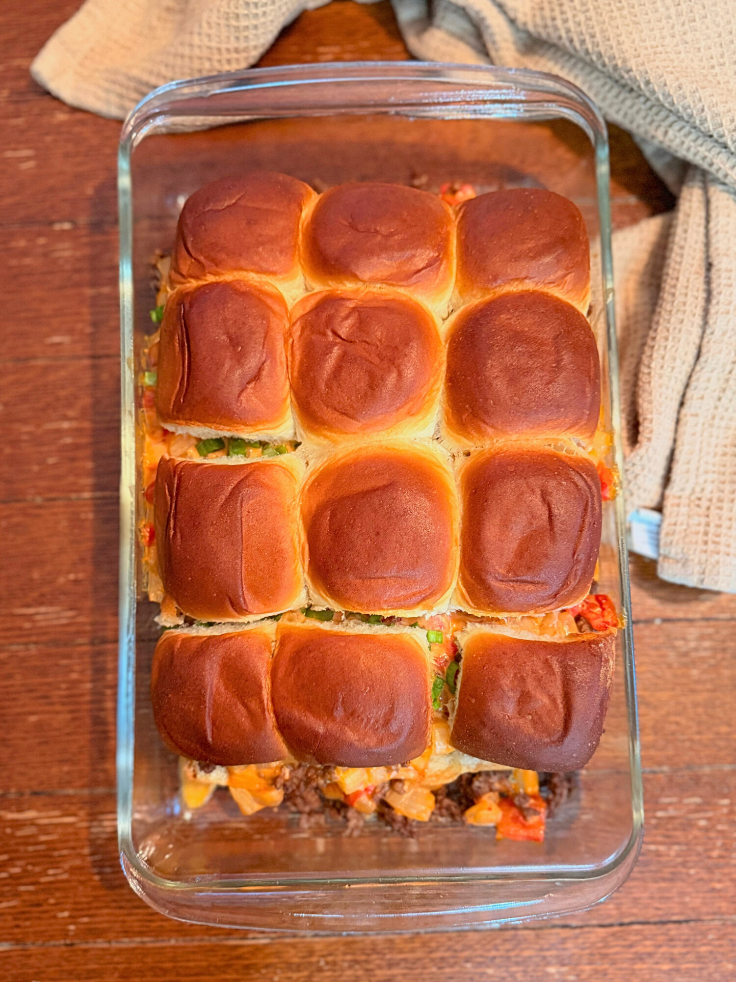 Ground beef queso sliders fresh out of the oven.
