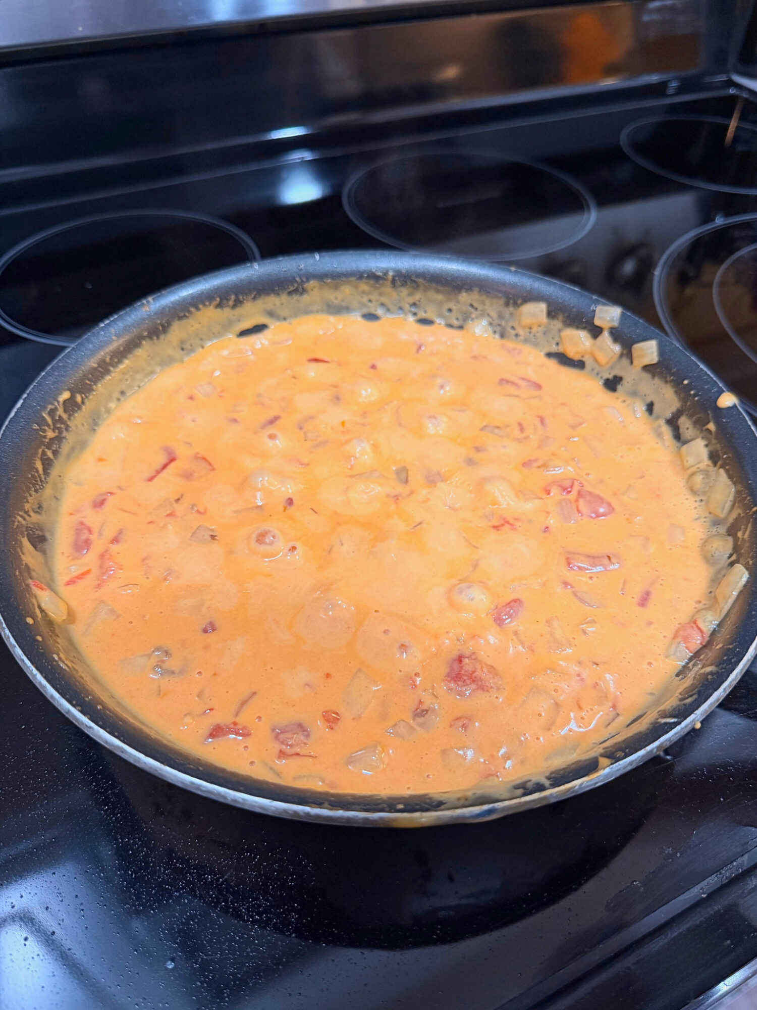 Velveeta cheese sauce in a skillet.