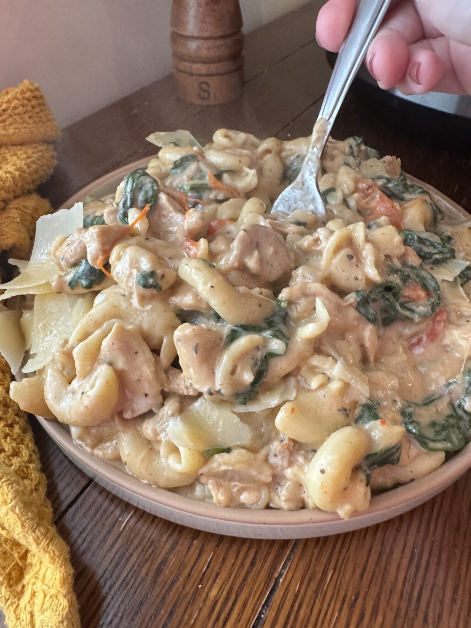 Close-up of a bowl of slow cooker creamy chicken pasta.